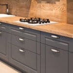 Professionally painted gray kitchen cabinets in a Baton Rouge home