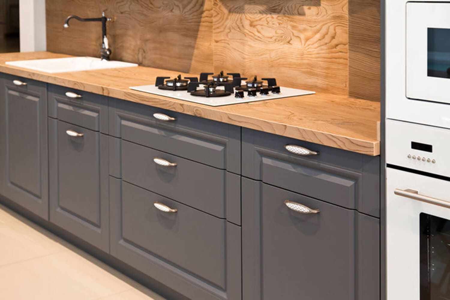 Professionally painted gray kitchen cabinets in a Baton Rouge home