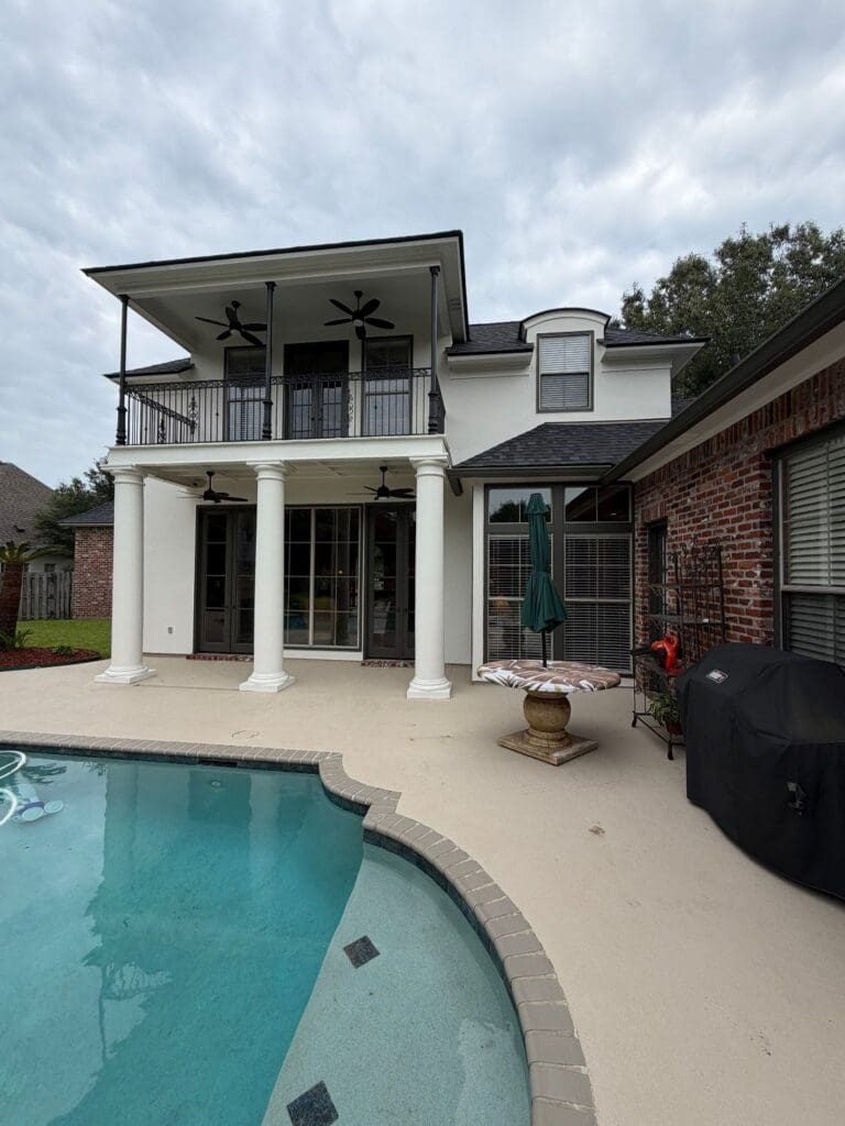 Rear two-story balcony after exterior painting in St. George, LA Santa Maria