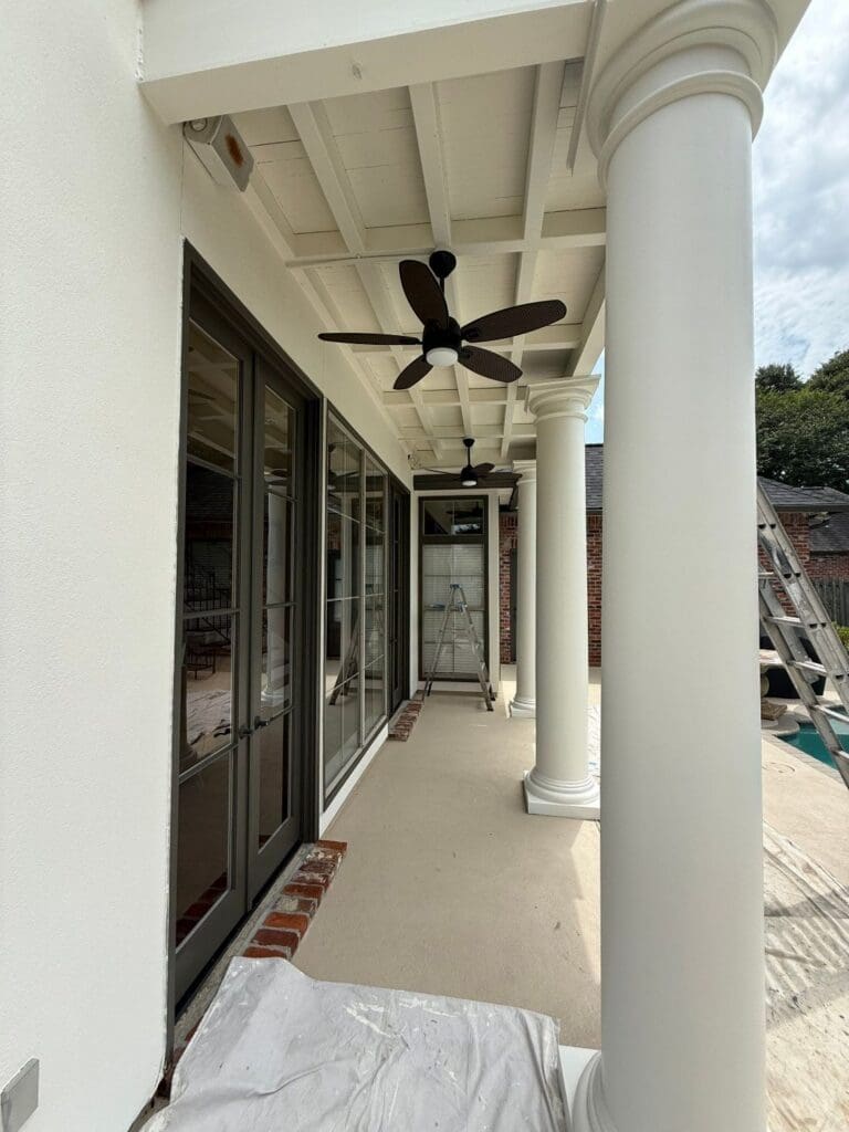 Painted porch ceiling and white columns on St. George, LA home exterior