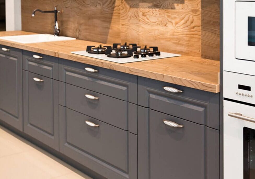 Professionally painted gray kitchen cabinets in a Baton Rouge home