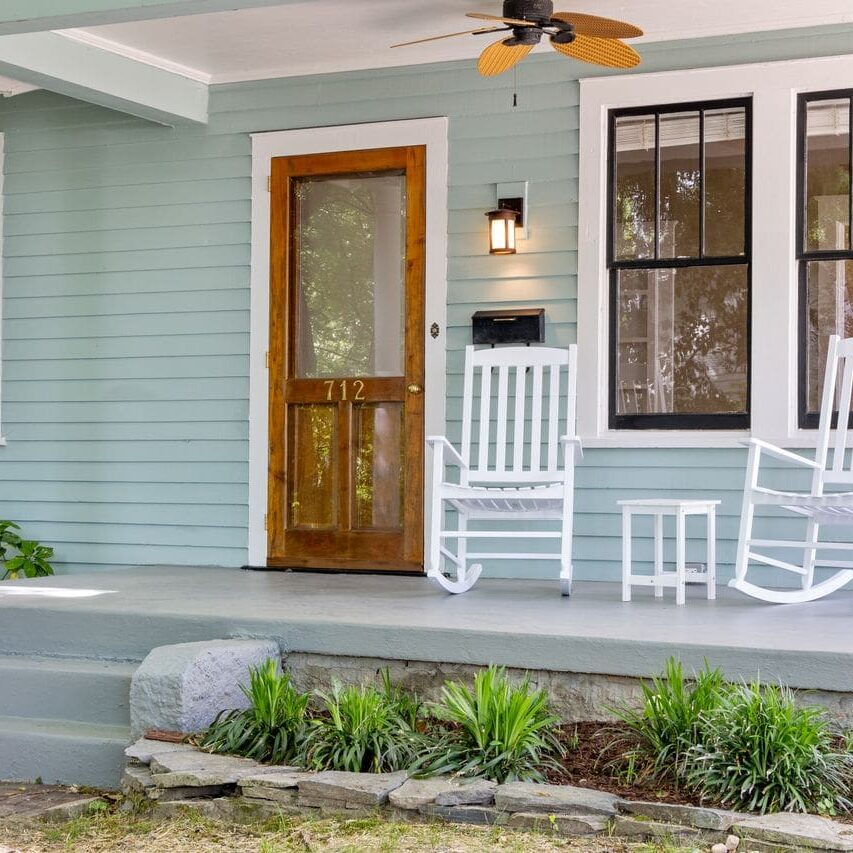 Exterior priming in Baton Rouge LA sealed the siding, porch columns, and trim on this home