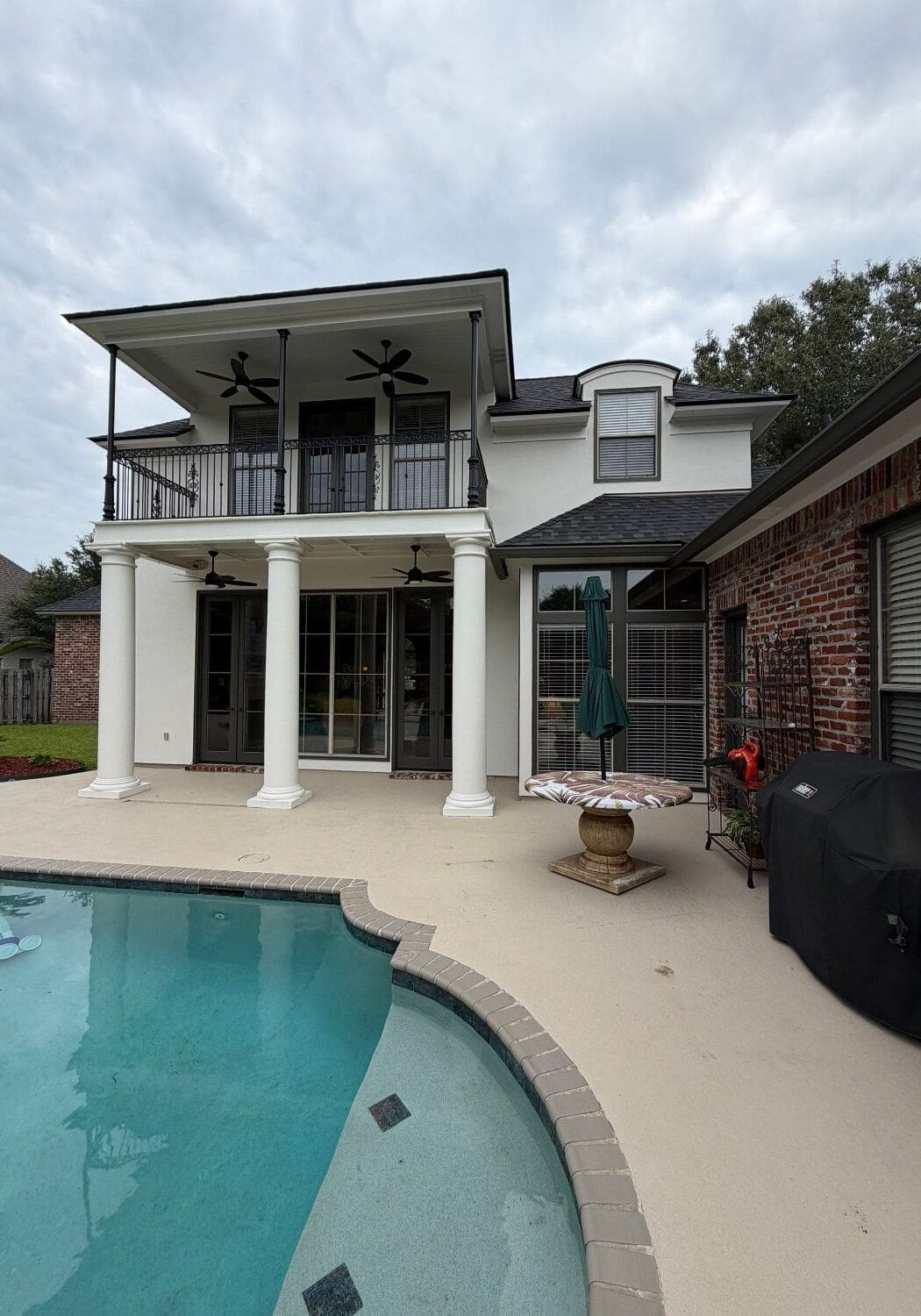 Rear two-story balcony after exterior painting in St. George, LA Santa Maria