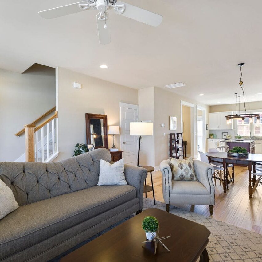 Wall painters in Baton Rouge LA finished the grey walls and white trim in this open living space