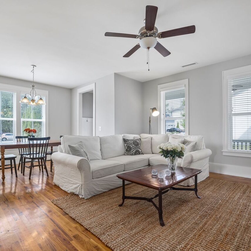 Wall painters in Baton Rouge LA applied a smooth grey finish to the walls in this living and dining area