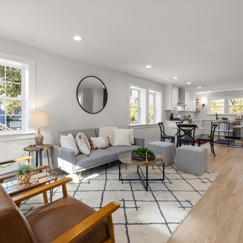 Wall painters in Baton Rouge LA finished the soft grey walls and white trim in this open plan space